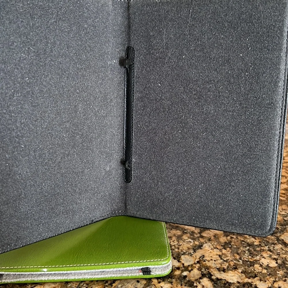 Kindle leather black cover. Binding 4” apart to attach to kindle